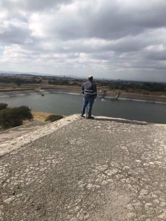 G8 crew overlooking the return water dam