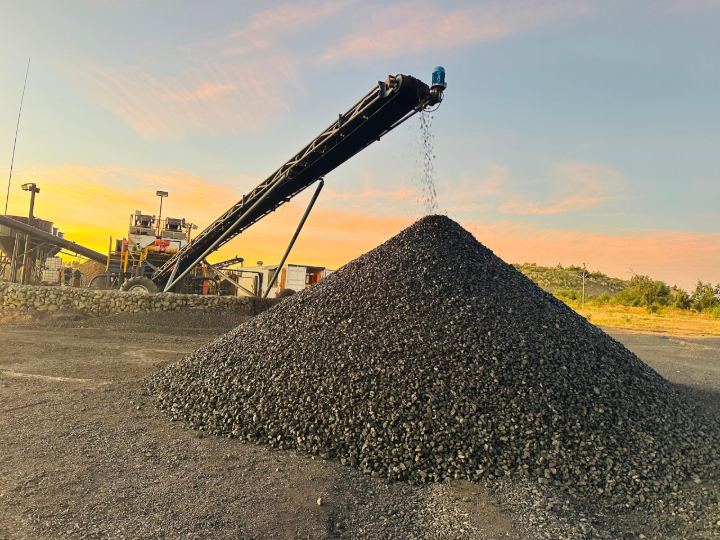 Conveyor discharging onto the product stockpile at sunset
